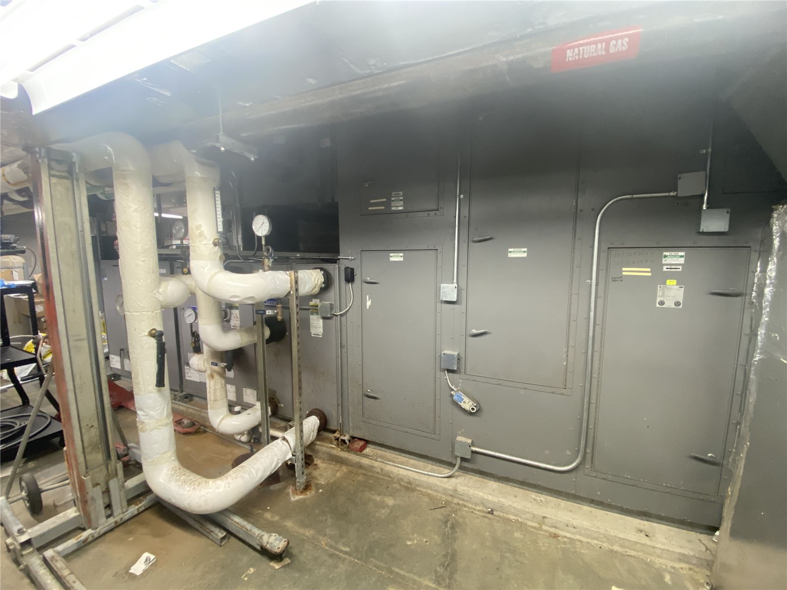 Commercial air handling unit with insulated refrigerant piping