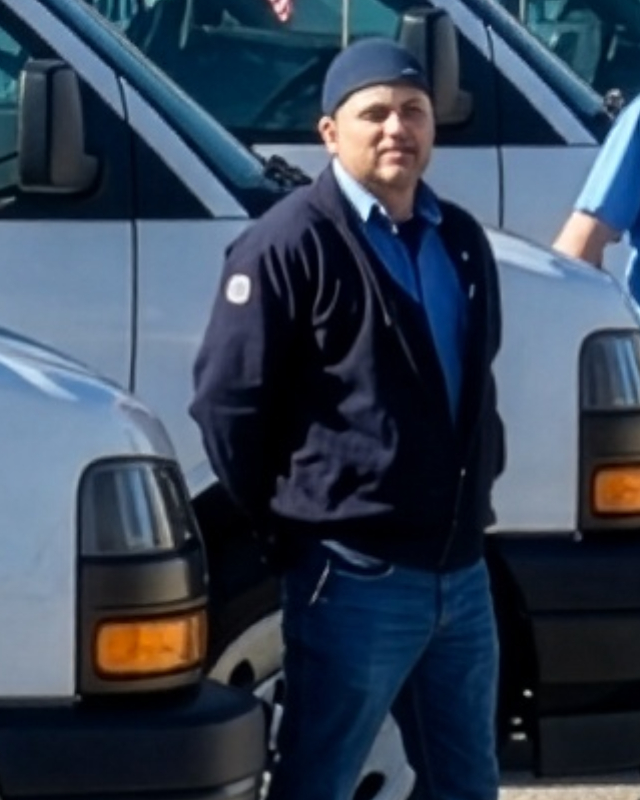 Valley Commercial Service technician in a navy jacket and cap